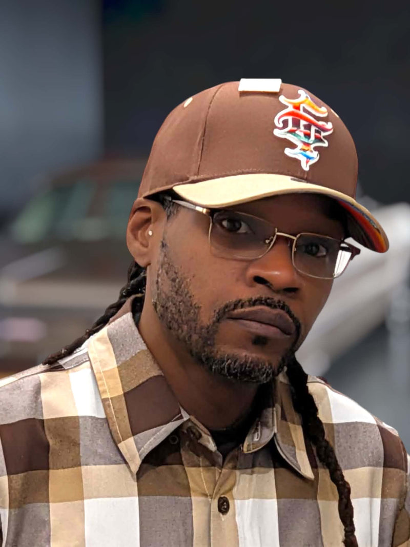 Clutch & Throttle G’d Up Low Rider Dad Hat worn close-up with embroidered front logo