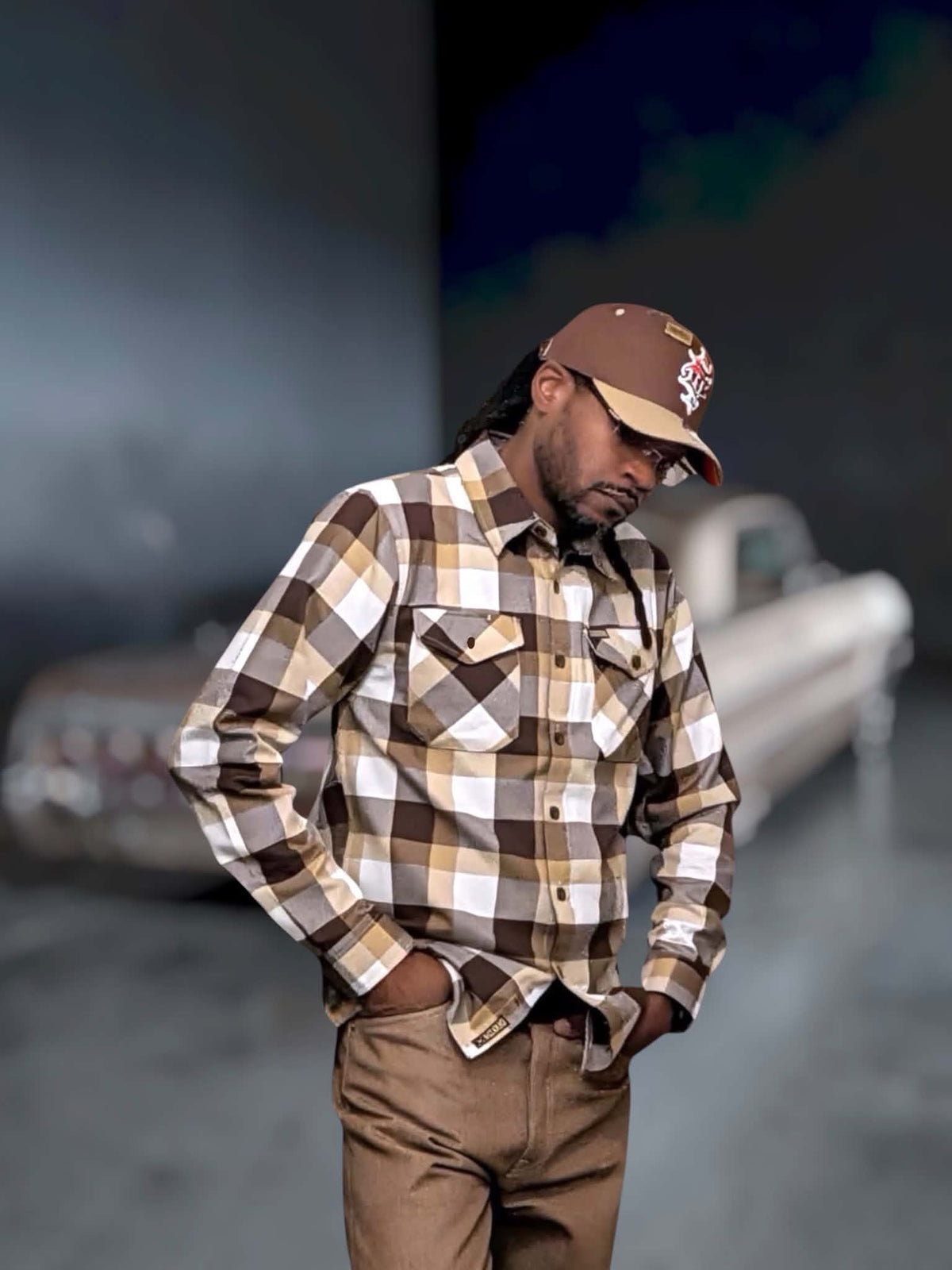 G’d Up Low Rider Dad Hat lifestyle view showing curved tan brim and brown crown