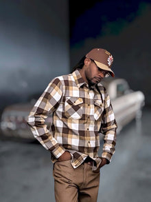 G’d Up Low Rider Dad Hat lifestyle view showing curved tan brim and brown crown