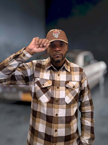 G’d Up Low Rider Dad Hat worn with brown plaid flannel, front view