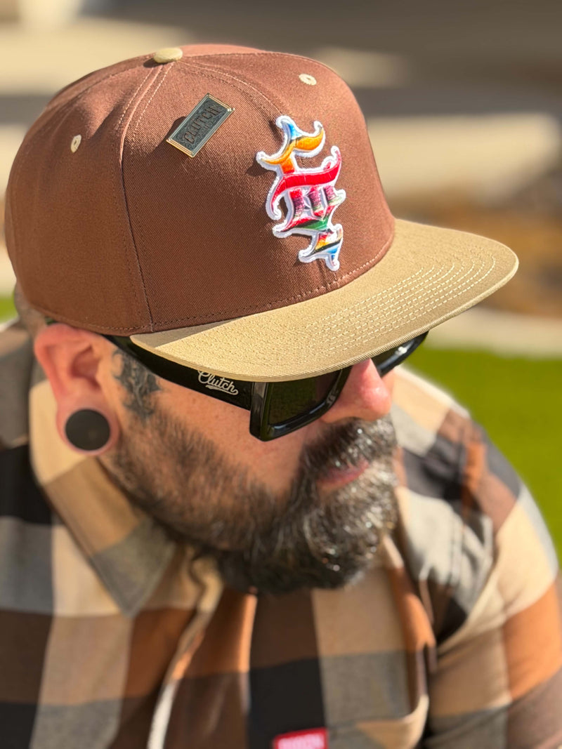 Clutch & Throttle G’d Up Low Rider Snapback worn close-up showing serape logo embroidery