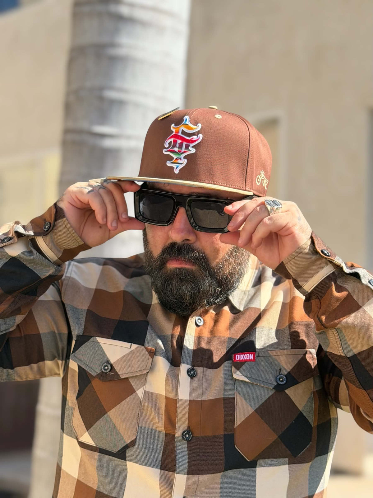 Front view of Clutch & Throttle G’d Up Low Rider Snapback worn with sunglasses