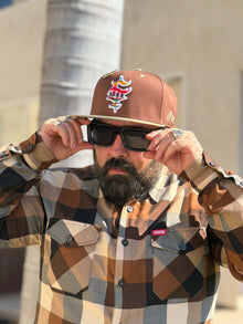Front view of Clutch & Throttle G’d Up Low Rider Snapback worn with sunglasses