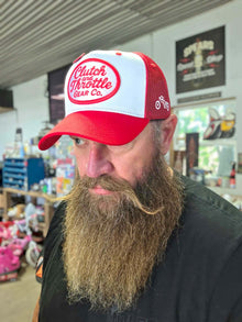 Red and white trucker worn in workshop