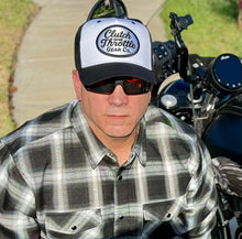 Black and white trucker paired with flannel