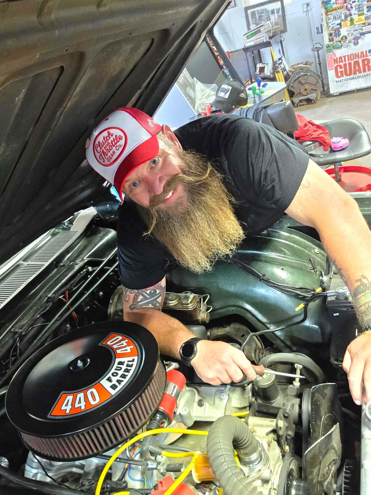 Red and white trucker worn in garage