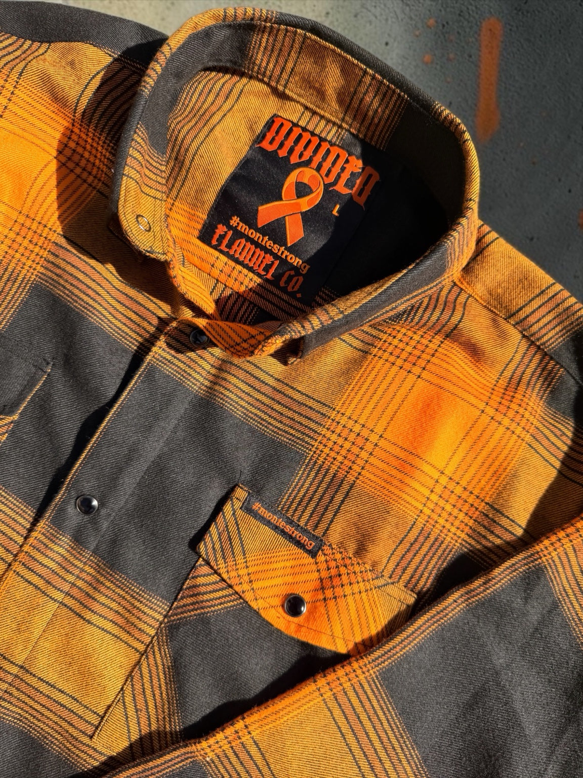 Monte Strong orange and charcoal plaid flannel original product photo