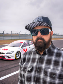 Front view of Clutch & Throttle Speed Racer Snapback worn at the racetrack