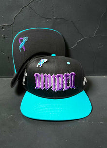 Black Divided Flannel Co. YANA snapback with teal brim and purple embroidery