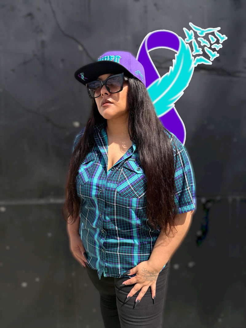 Women’s YANA bamboo short sleeve shirt with purple YANA snapback lifestyle view
