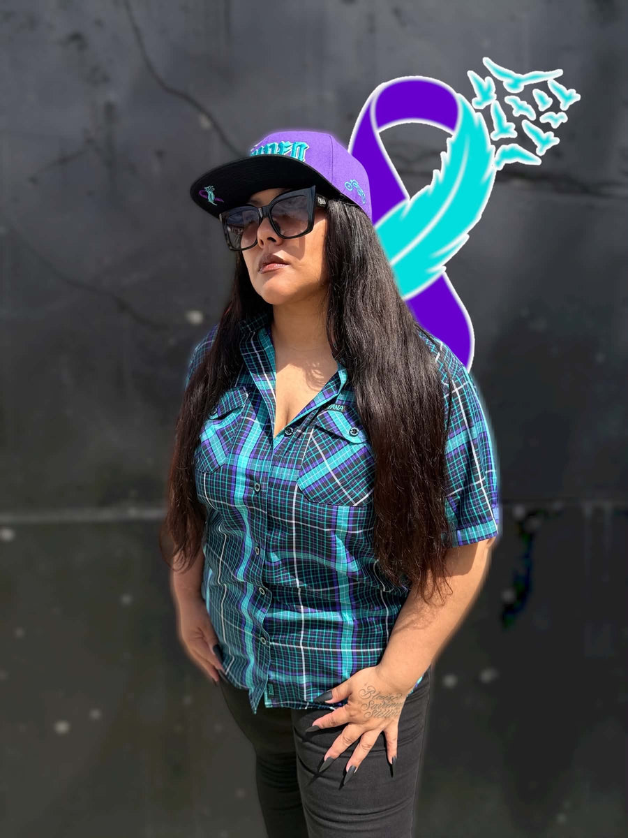Women’s YANA bamboo short sleeve shirt with purple YANA snapback lifestyle view